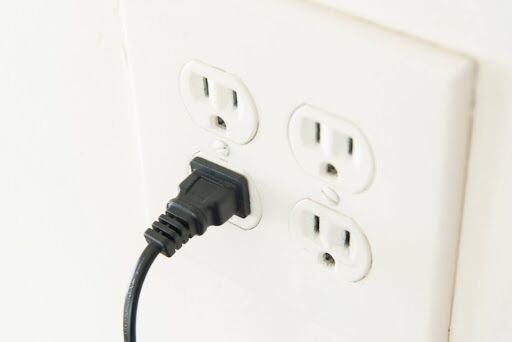A plug in a wall outlet.